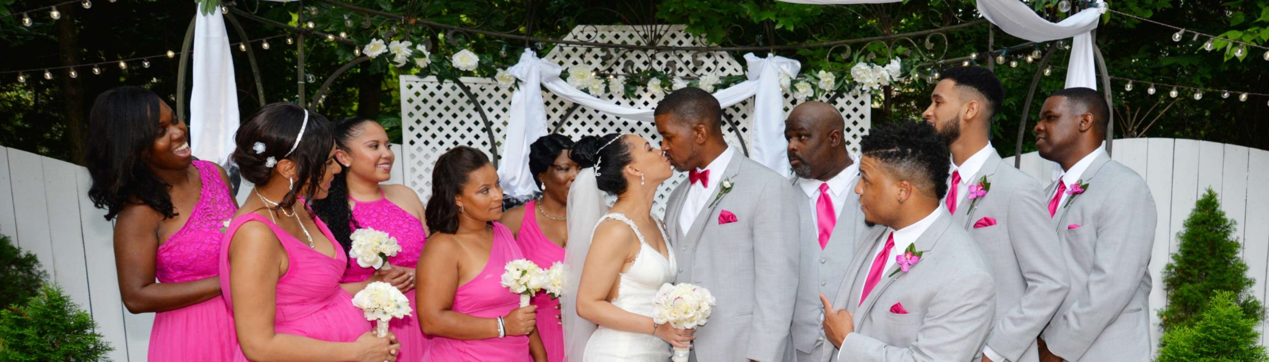 bride and groom kiss during outdoor wedding