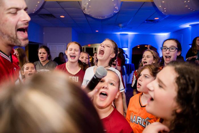 group of kids singing into microphone at special events venue party in Marietta, GA